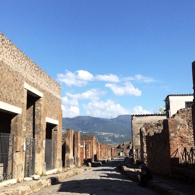 a cobblestone street lined with stone buildings