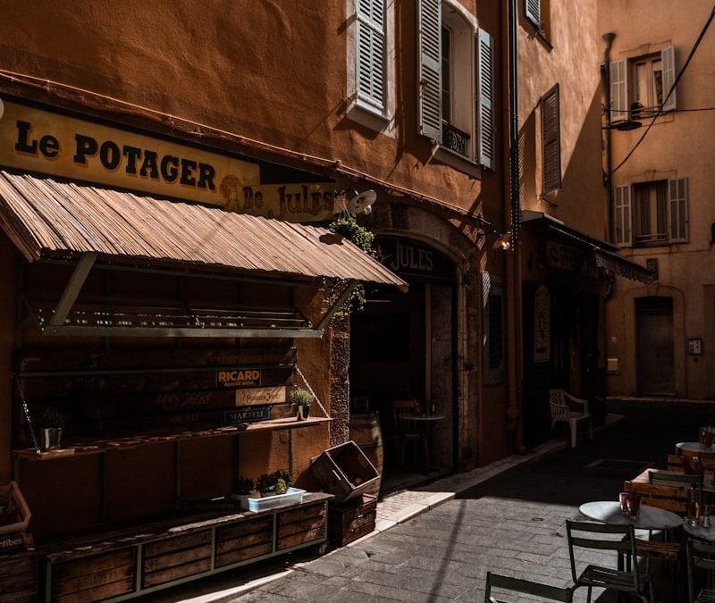 9 of the World’s Oldest Restaurants to Visit for Food and History 9 a street with tables and chairs