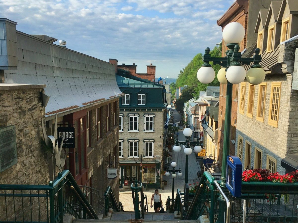 8 Beautiful Streets Around the World to Walk at Least Once 6 View down a historic european street with buildings and buildings.
