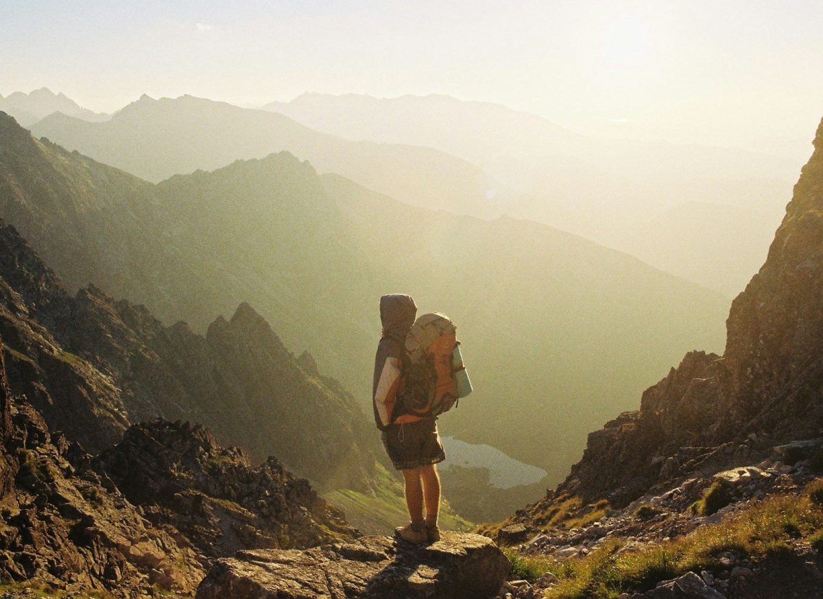 9 Essential Safety Tips for Solo Travelers 6 climber standing on rock near overlooking view of mountain at daytime