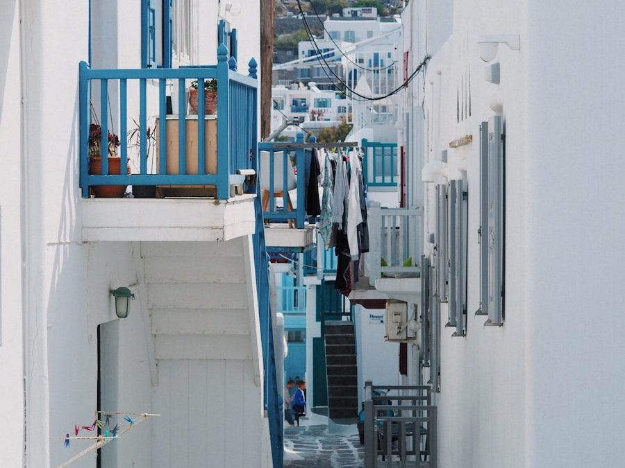 8 Beautiful Streets Around the World to Walk at Least Once 1 a narrow alley way with blue balconies and white buildings