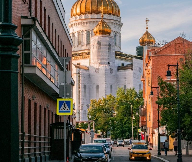 10 Amazing Long Train Trips Around the World for Travelers 2 a city street with a church in the background