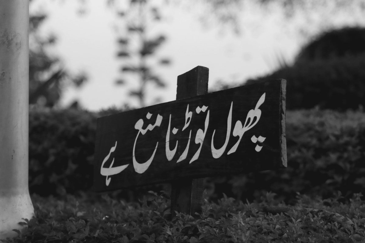 a black and white photo of a street sign