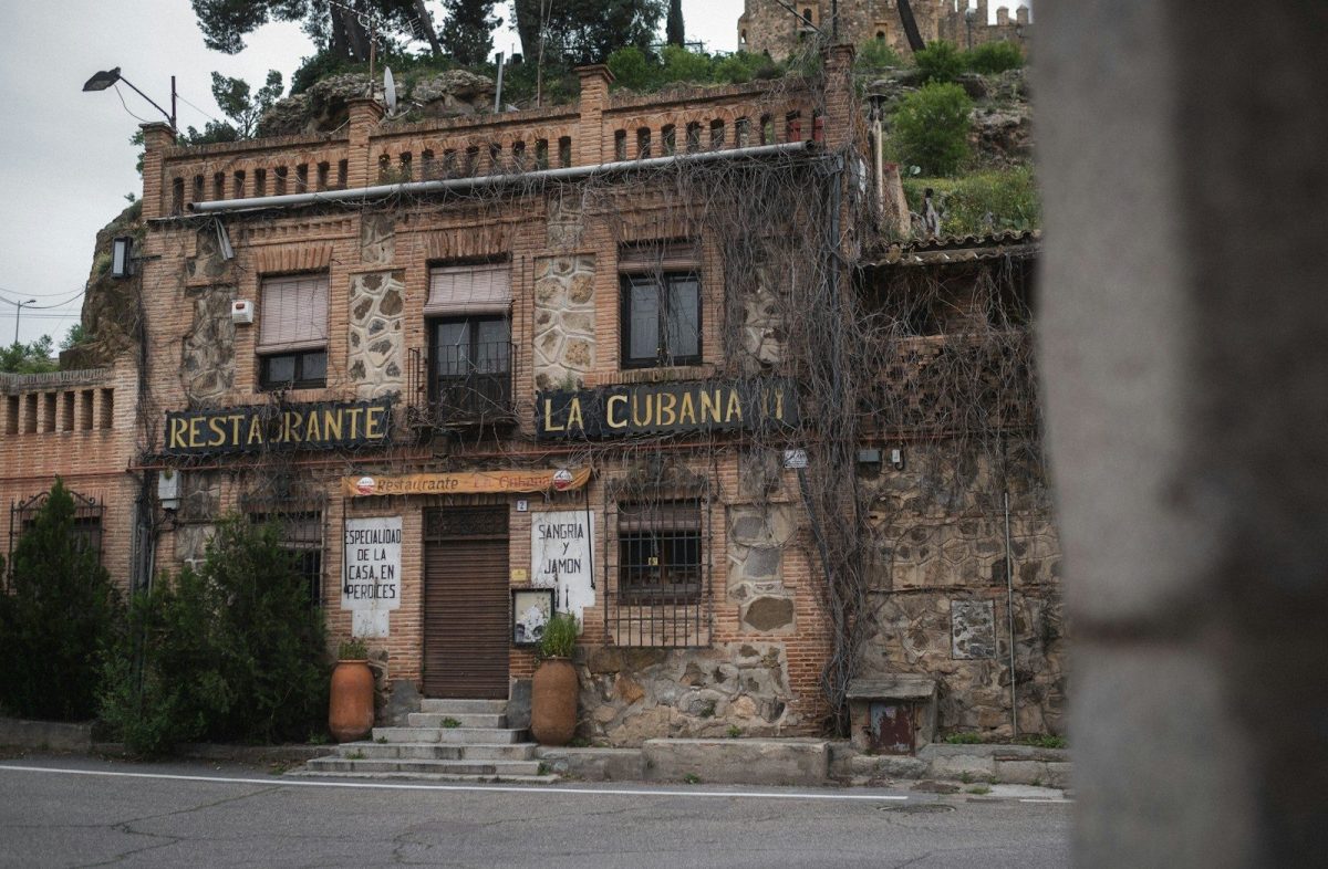 9 of the World’s Oldest Restaurants to Visit for Food and History 6 an old building with vines growing on the side of it