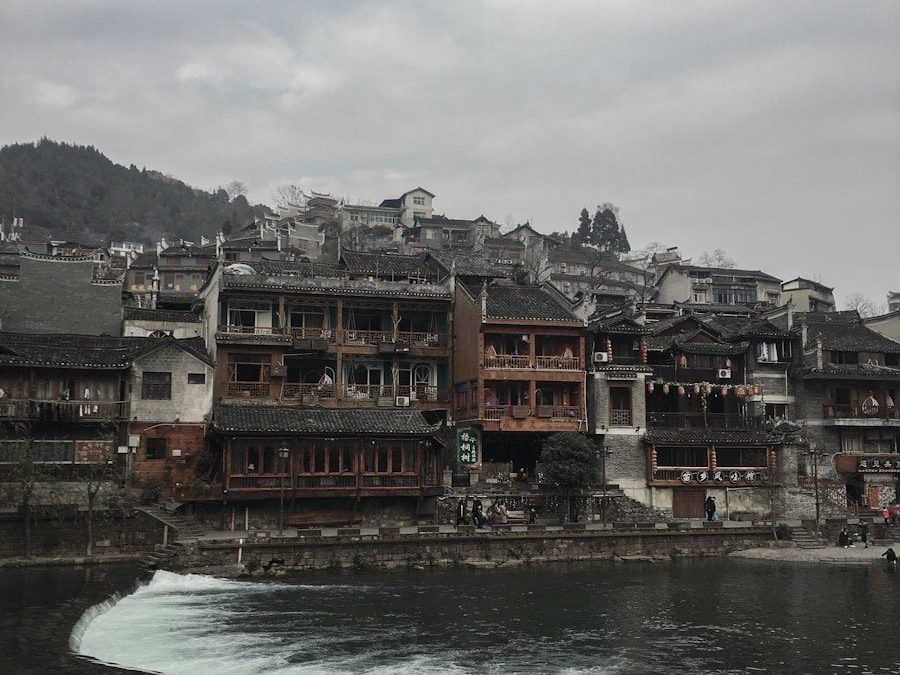 brown concrete buildings beside beach