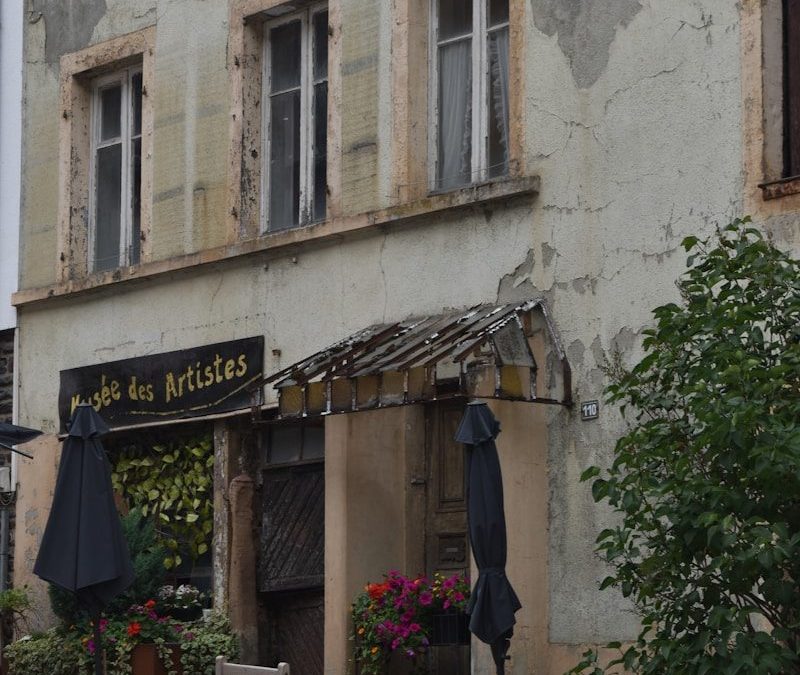 9 of the World’s Oldest Restaurants to Visit for Food and History 3 an old building with tables and chairs outside