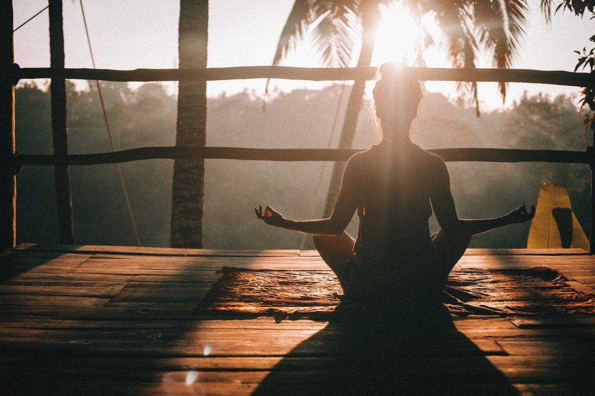 5 Luxury Wellness Retreats in the U.S. for Rest, Focus, and Mental Clarity 2 woman in black tank top sitting on brown wooden dock during daytime