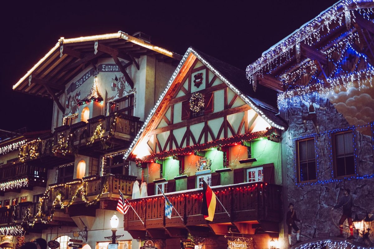 Charming Bavarian style building in Leavenworth illuminated with festive lights at night.