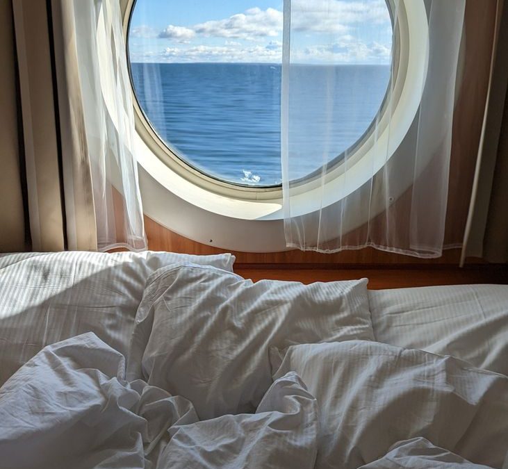 Luxurious cruise ship cabin with sea view. Relaxing ambiance for perfect getaway.