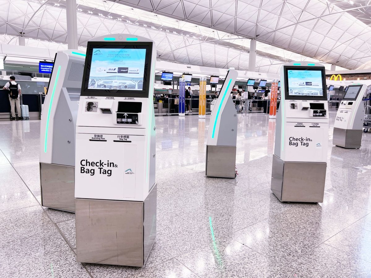 5 Bag Drop Details Travelers Often Learn Too Late at the Airport 2 Modern check in kiosks at Hong Kong International Airport's terminal. Efficient travel is enhanced by technology.