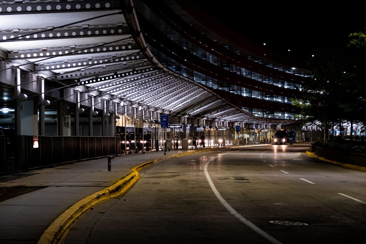 Modern architecture and empty roads at Chicago&amp;amp;#39;s O&amp;amp;#39;Hare Airport captured at night.