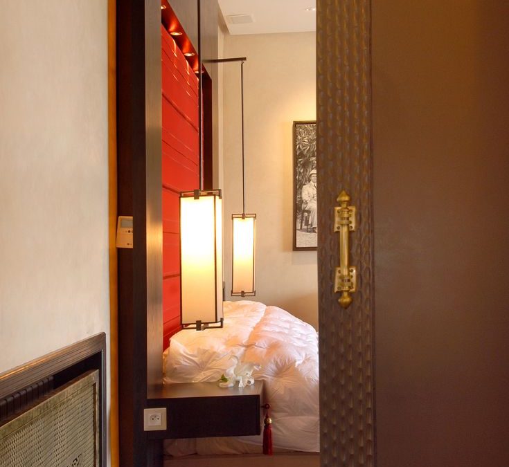 Luxurious bedroom entrance featuring elegant doors and contemporary lighting in a Marrakech hotel.