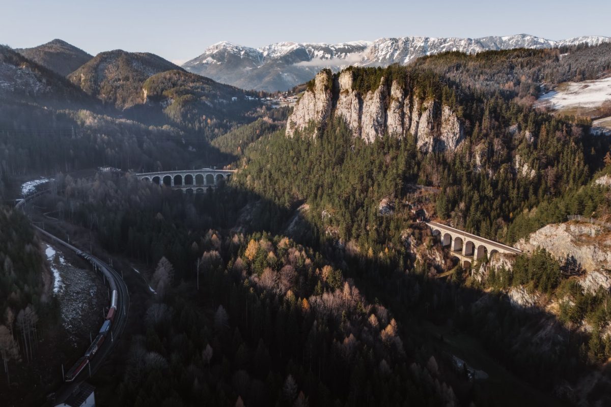 A breathtaking aerial view of the Semmering Railway with stunning viaducts and alpine scenery.