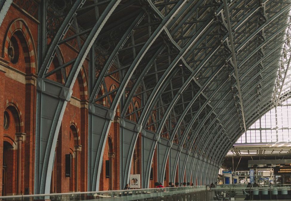 Captivating view of iron and brick architecture in a historic train station interior.