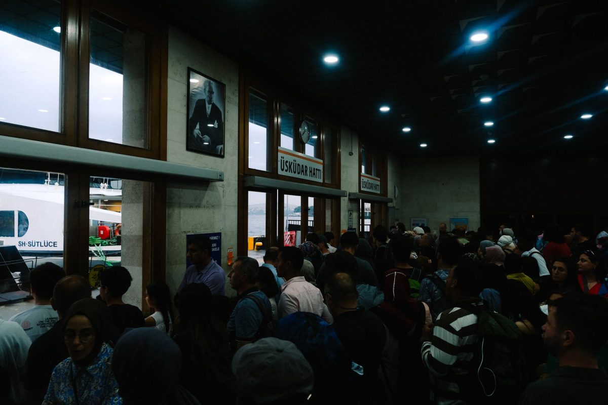 A bustling scene inside a crowded ferry terminal in Istanbul, capturing daily travel.
