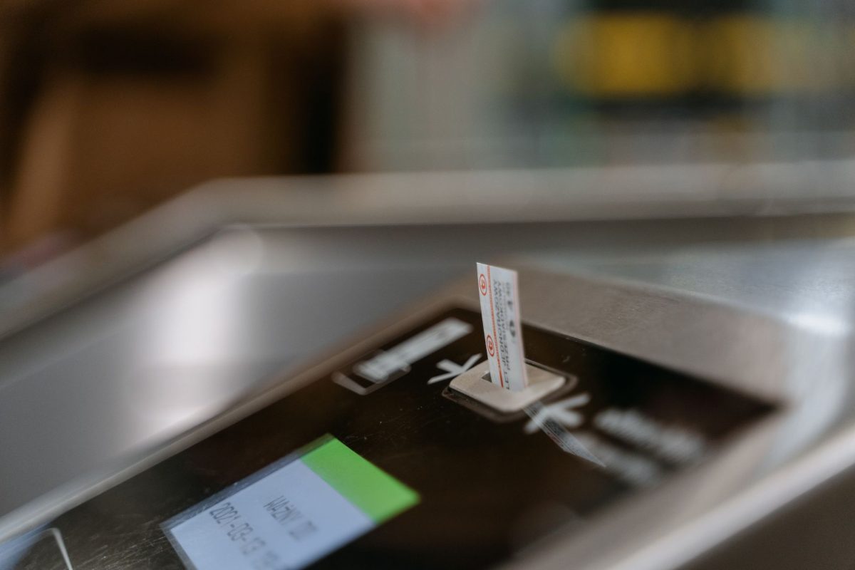 5 Ferry Boarding Habits That Keep a Short Crossing From Feeling Like a Fire Drill 2 Close up image of a subway ticket machine with a ticket inserted, highlighting public transportation convenience.
