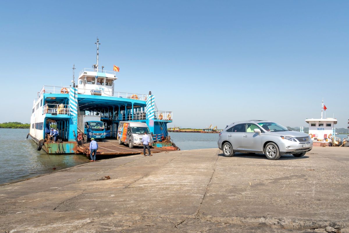 5 Ferry Boarding Habits That Keep a Short Crossing From Feeling Like a Fire Drill 5 Ferry loaded with vehicles docked at a sunlit harbor, showcasing transportation and travel.
