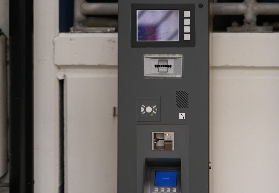Close up of a parking payment terminal in an indoor garage in Almere, Netherlands.